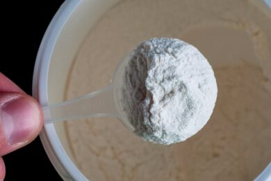 Powder-in-a-measuring-spoon-in-a-hand